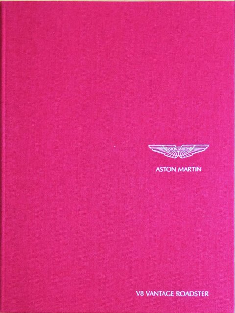 Aston Martin V8 Vantage Roadster nr. 702976, - 20,0 x 26,0 (book), 60, EN year - folder brochure